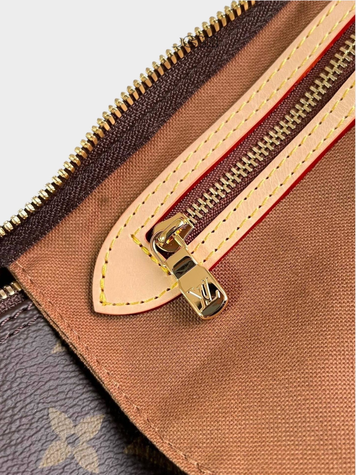 Zebass Louis Vuitton monogram canvas satchel interior featuring gold-tone hardware, zip closure, and leather trim.