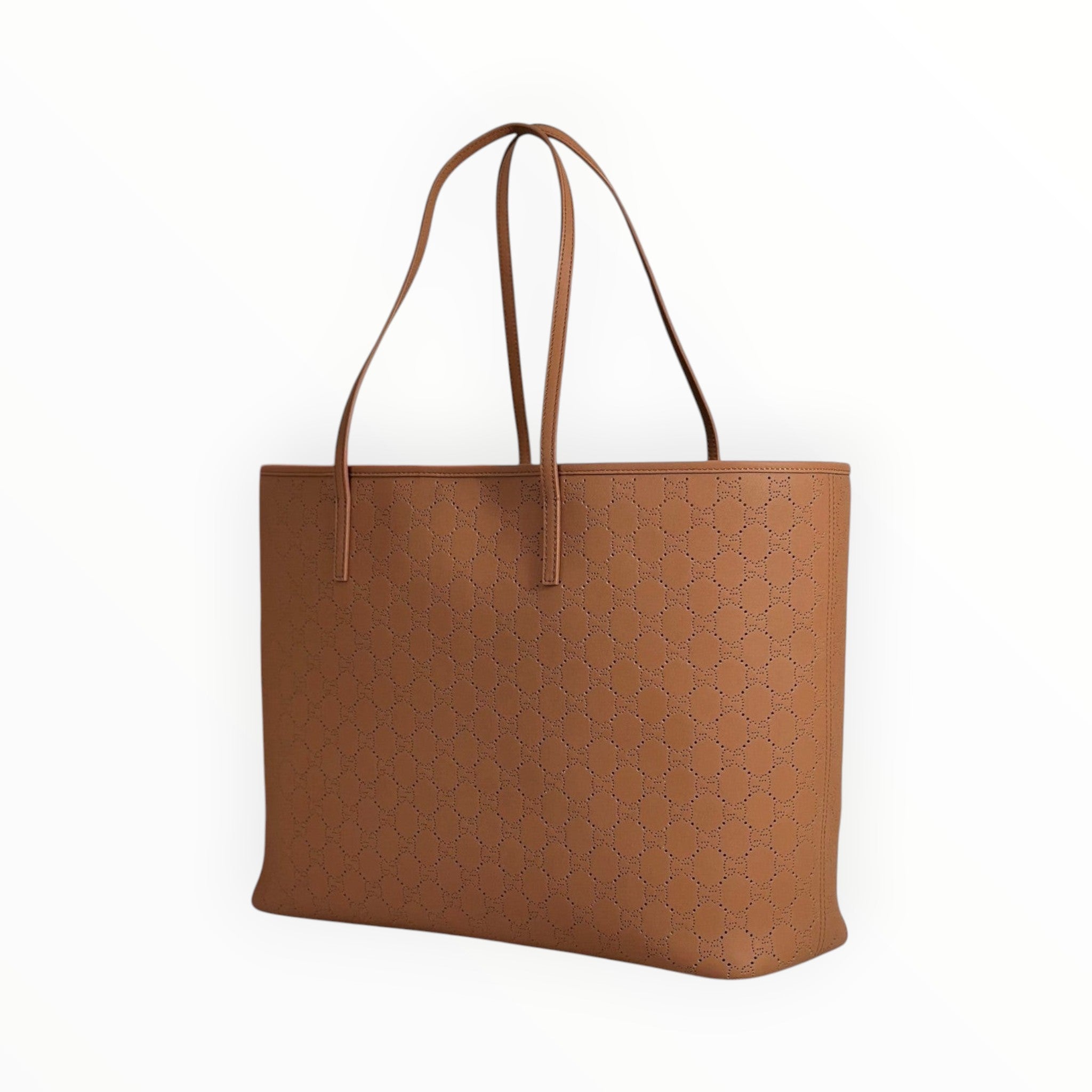 Zebass tan leather GUCCI tote bag with laser-cut monogram pattern and structured shoulder straps on a marble surface.
